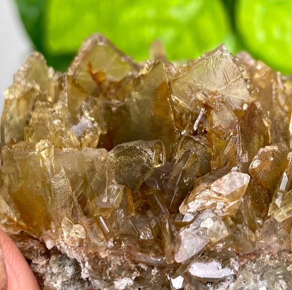 Rounded cluster of amber transparent baryte blades from Yunnan, China, top view