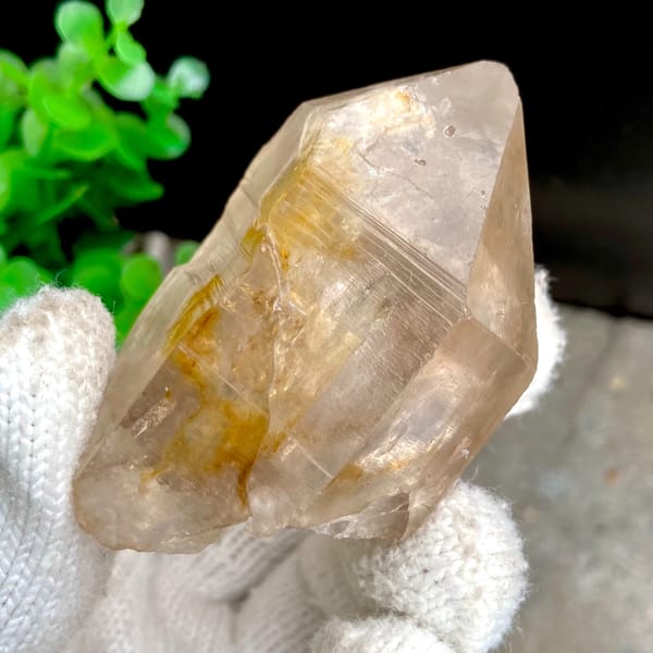 Transparent single quartz crystal with golden phantom from Sichuan, China, top view