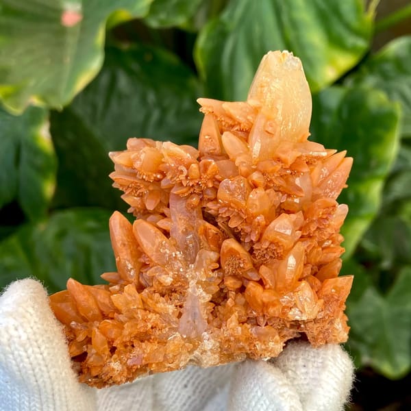 Orange calcite cluster of stacked pointed crystals from Yunnan, China, reverse side