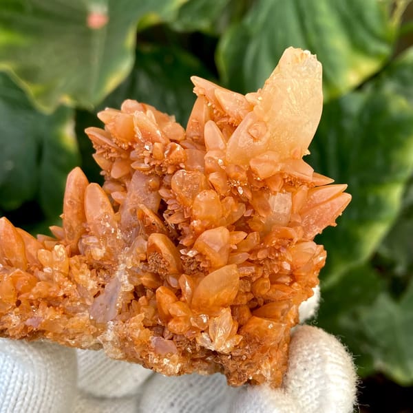Orange calcite cluster of stacked pointed crystals from Yunnan, China, overall view