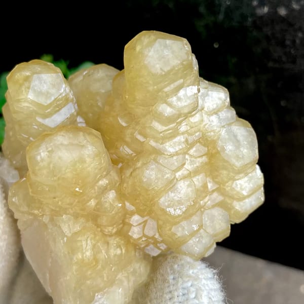 Honey-yellow stepped calcite columns in rounded group from Guizhou, China, reverse side