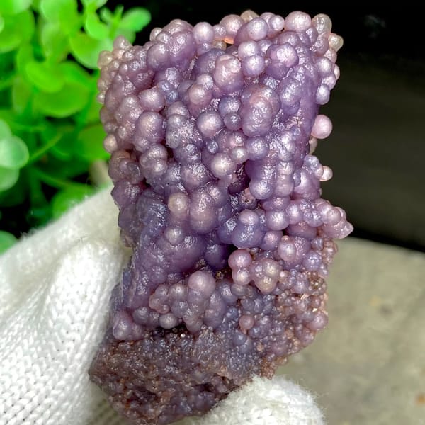 Tall cluster of purple grape agate balls from Indonesia, reverse side