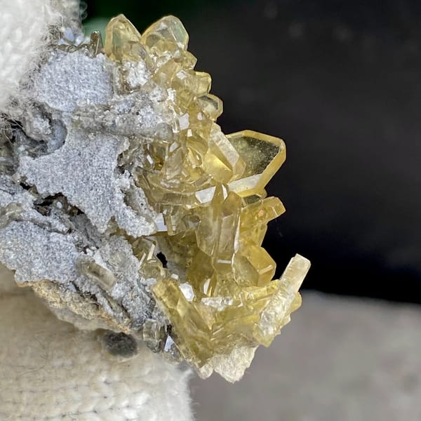 Golden transparent baryte blades on grey matrix from Yunnan, China, second angle
