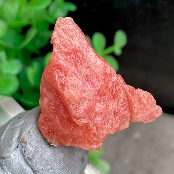 Salmon-pink rhodochrosite nugget from Wuzhou, Guangxi, China, close-up of the crystal faces