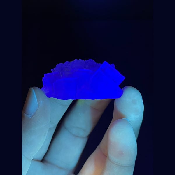 Translucent pale fluorite with frosted top and blue heart from Zhejiang — detail view