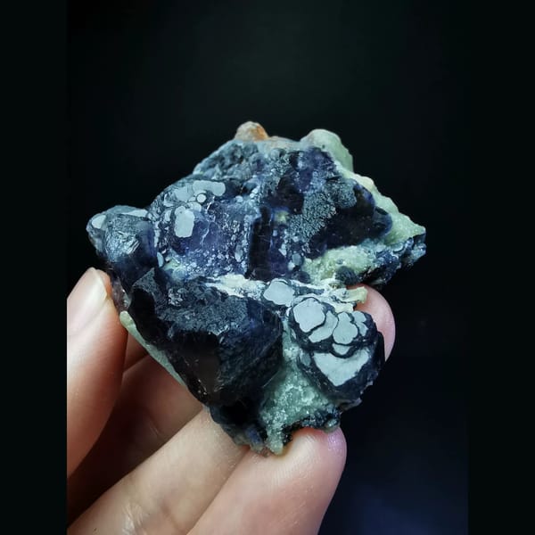 Purple fluorite cluster with combined forms — alternate view