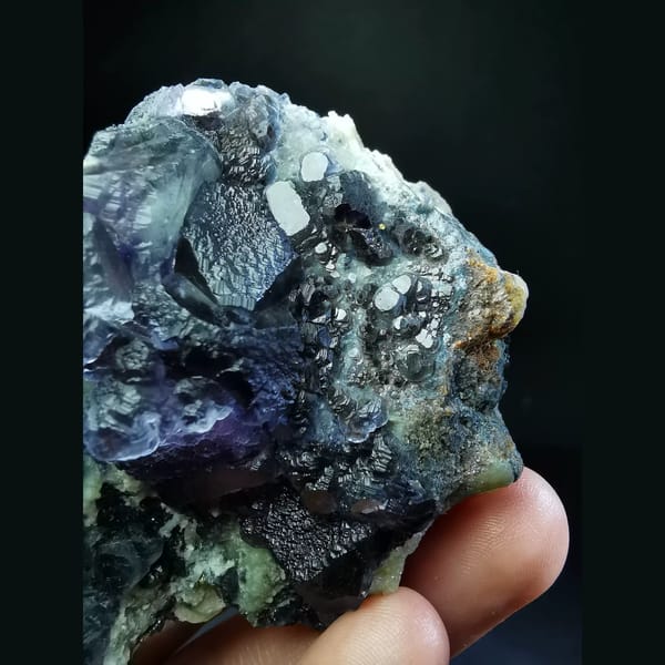 Purple fluorite cluster with combined forms — alternate view