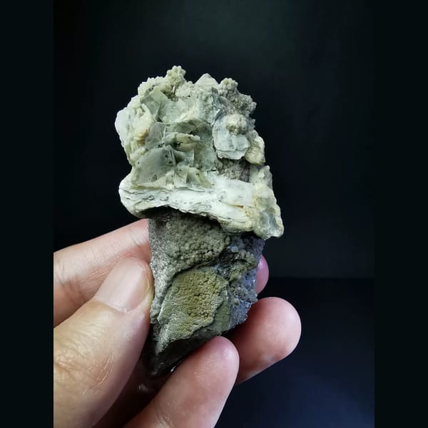 Quartz crystal topped with ruffled ear-shaped calcite — alternate view