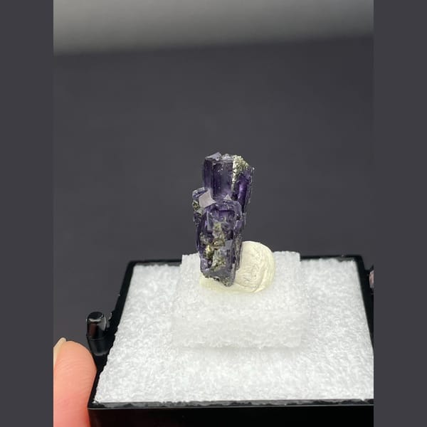 Deep purple fluorite cubes on dark matrix from Yaogangxian, Hunan — detail view