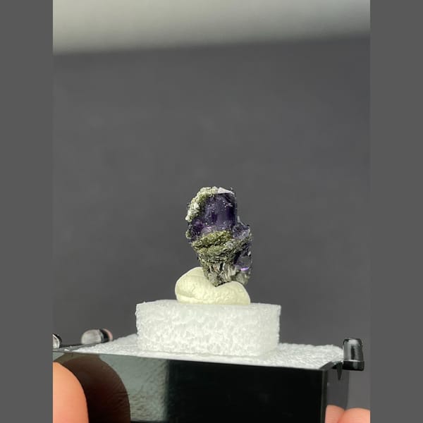 Deep purple fluorite cubes on dark matrix from Yaogangxian, Hunan — detail view