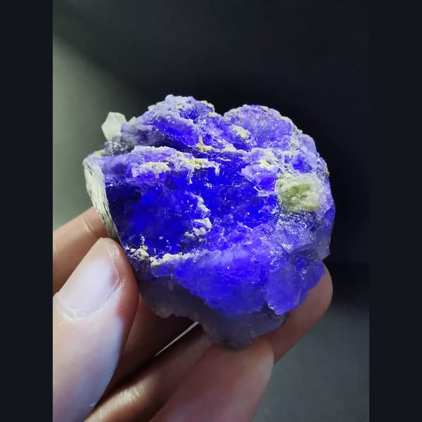 Stepped blue-purple fluorite with quartz — detail view