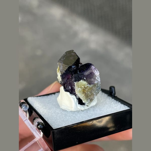 Dark purple fluorite with greenish mica from Inner Mongolia — detail view