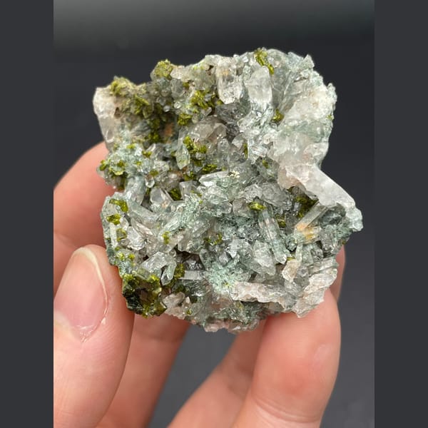 Glassy green phantom quartz with dark green epidote from Meigu, Sichuan — detail view