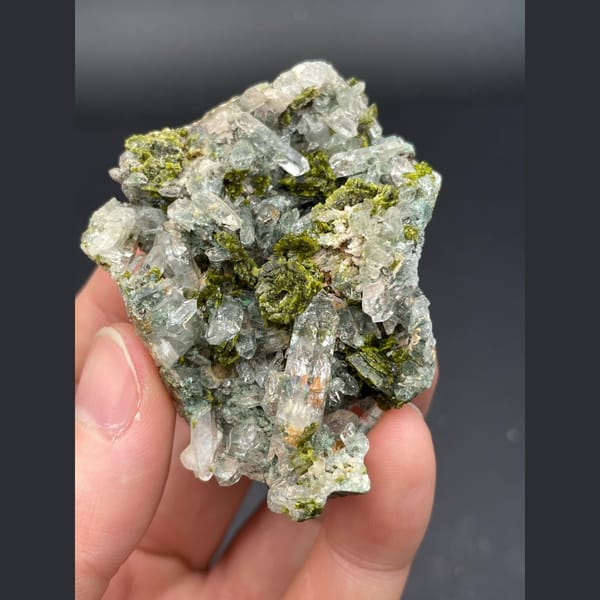 Glassy green phantom quartz with dark green epidote from Meigu, Sichuan — detail view