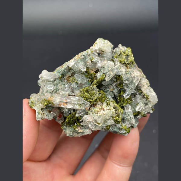 Glassy green phantom quartz with dark green epidote from Meigu, Sichuan — detail view