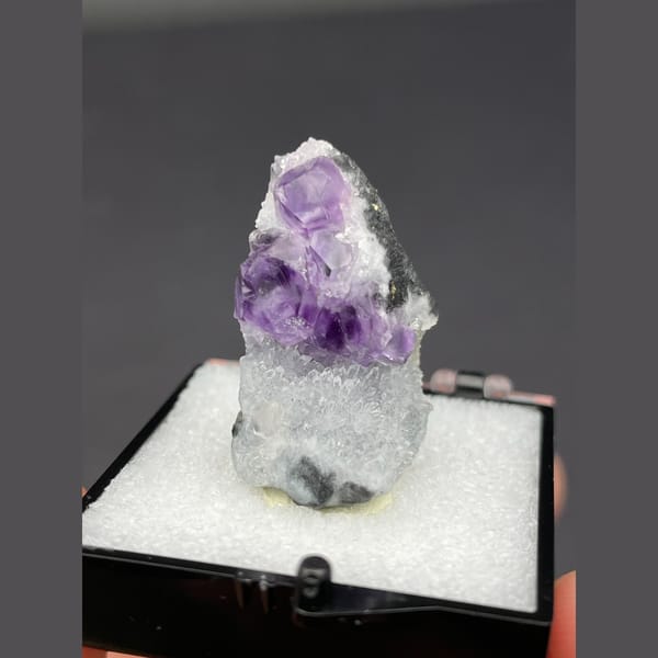 Purple fluorite cubes on white quartz from Fujian — complete view