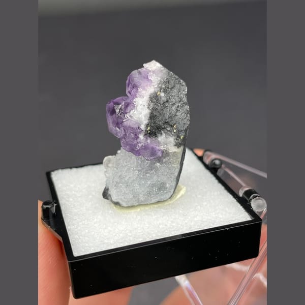 Purple fluorite cubes on white quartz from Fujian — detail view
