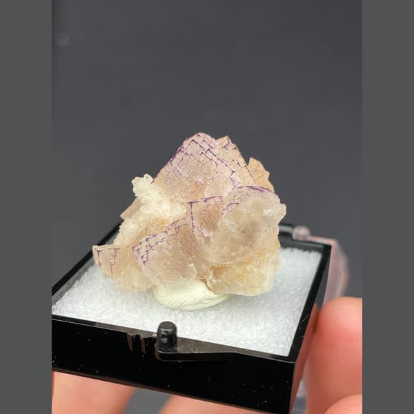 Peach fluorite with purple grid-like edges from Guizhou — complete view