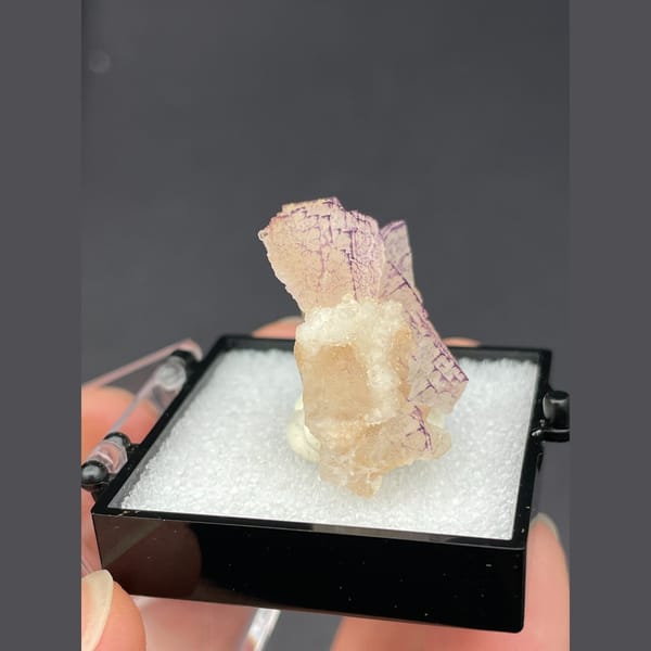 Peach fluorite with purple grid-like edges from Guizhou — alternate view