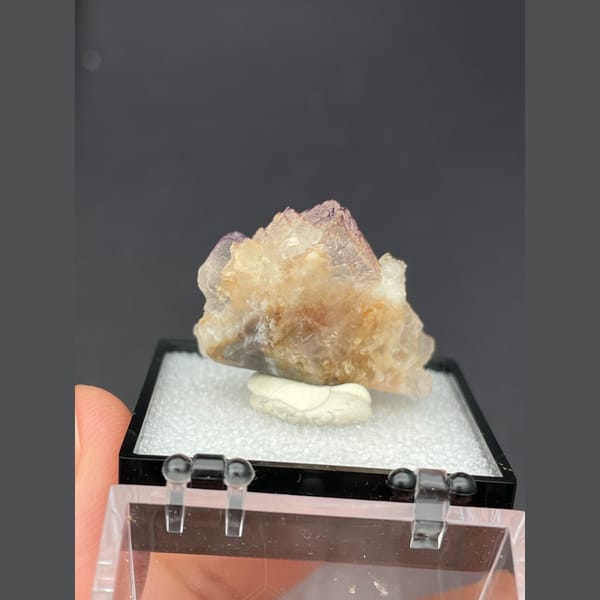 Peach fluorite with purple grid-like edges from Guizhou — detail view