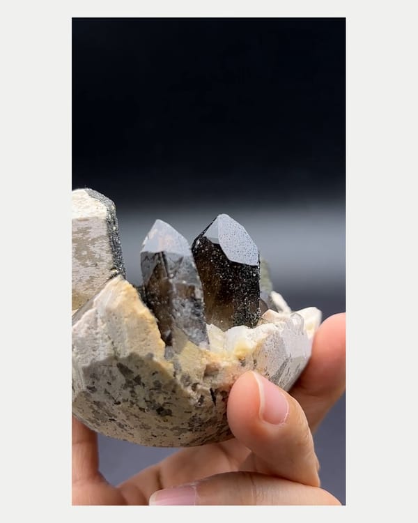 Complete reverse view of cream feldspar and smoky quartz