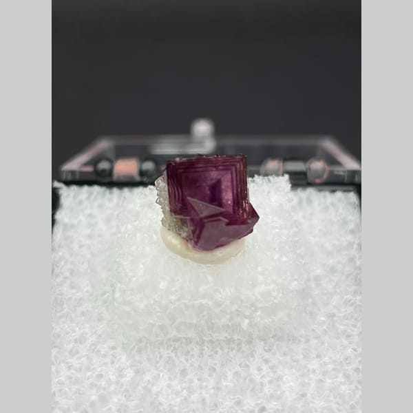 Tiny magenta purple fluorite crystal from Anhui — complete view