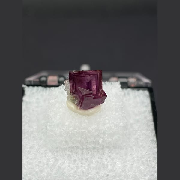 Tiny magenta purple fluorite crystal from Anhui — alternate view