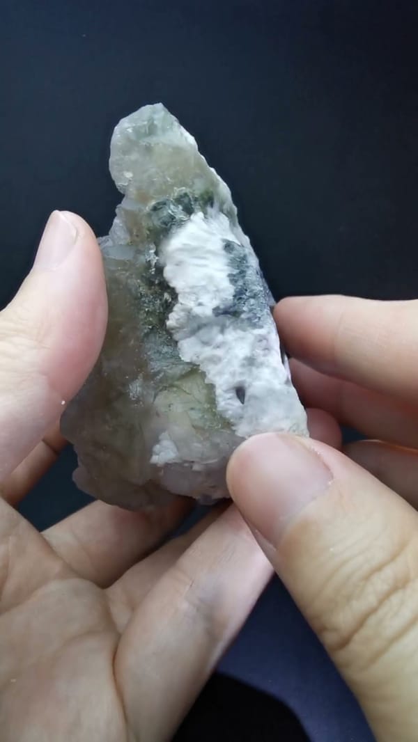 Pale yellow-violet fluorite on candle quartz — complete thin side view of the exact specimen
