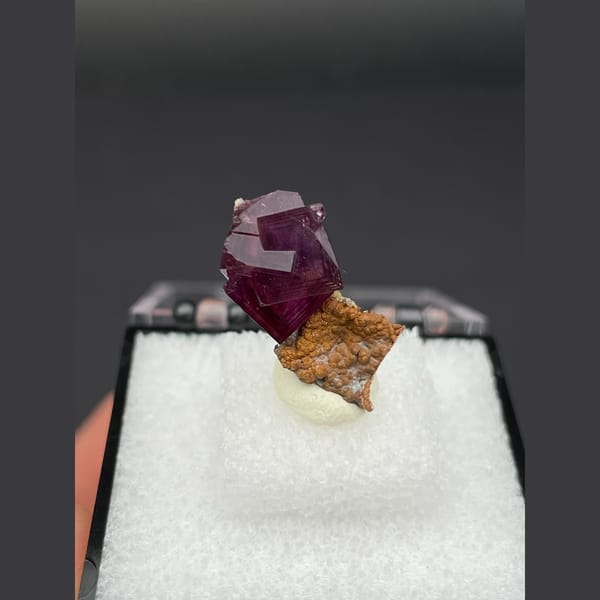 Magenta fluorite crystal with native copper from Anhui — complete view