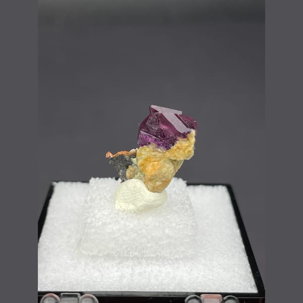 Magenta fluorite crystal with native copper from Anhui — alternate view