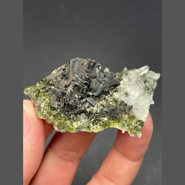 Dark bladed crystals with green epidote and quartz from Zhaotong — complete view