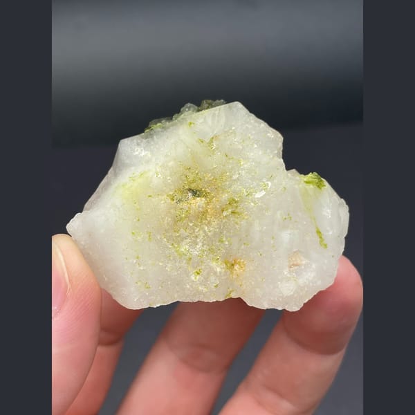 Milky quartz points with dark green epidote from Sichuan — detail view