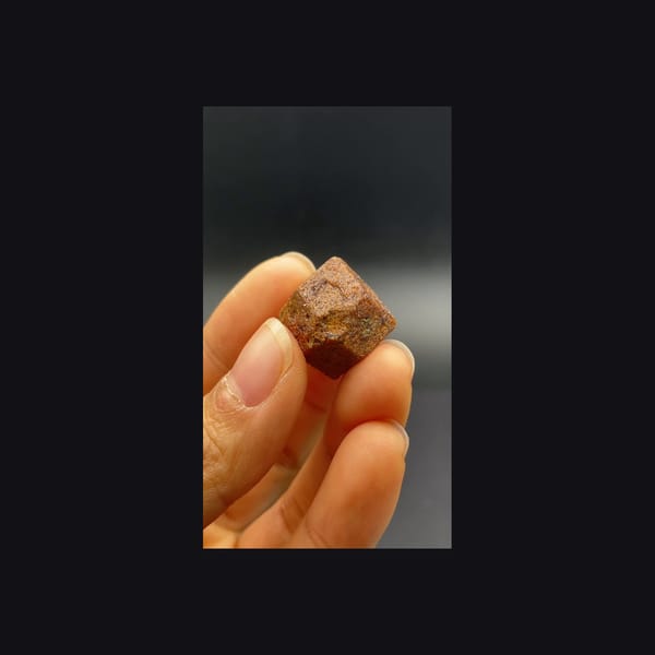 Whole dodecahedral andradite garnet from Hebei, reverse view