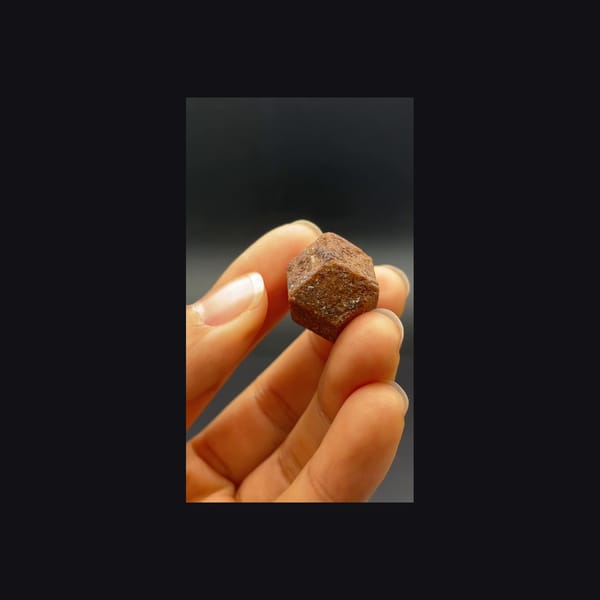 Whole dodecahedral andradite garnet from Hebei, left view