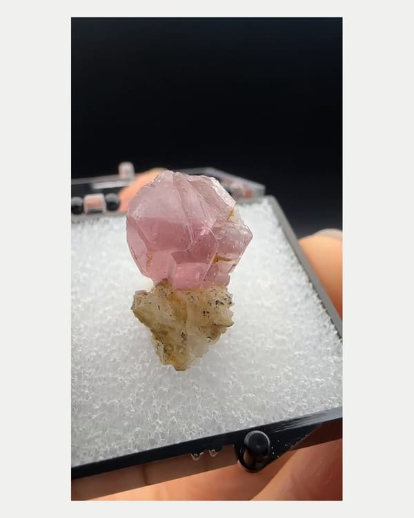 Complete left side view of blocky pink apatite crystal