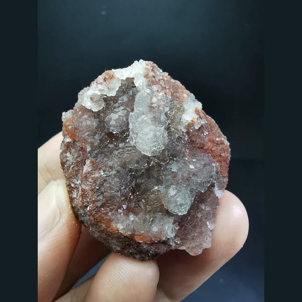 Ball-shaped fluorite on red matrix from Huanggangliang — complete view