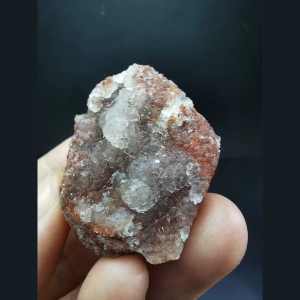 Ball-shaped fluorite on red matrix from Huanggangliang — alternate view