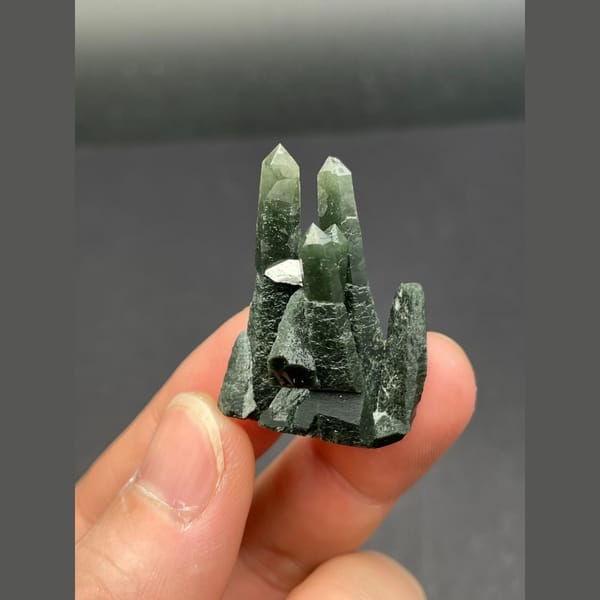 Dark green chlorite-included quartz points from Inner Mongolia — alternate view