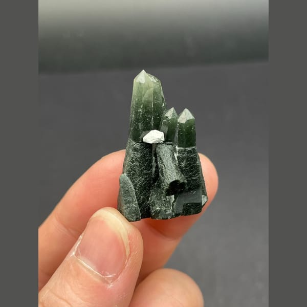 Dark green chlorite-included quartz points from Inner Mongolia — alternate view