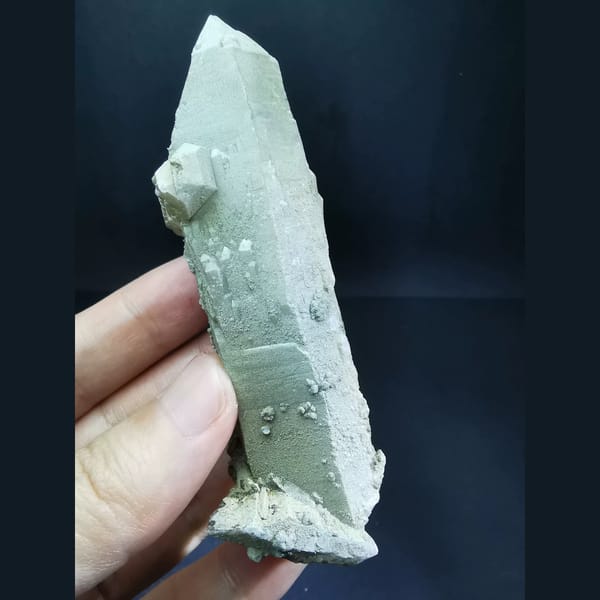 Double-terminated green-skin quartz with calcite — detail view