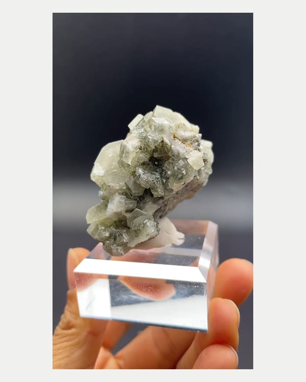 Complete side view of pale green fluorapatite crystals