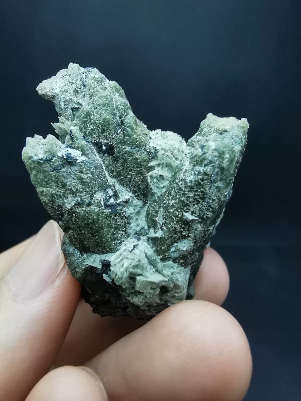 Complete rear view of the exact quartz and hematite specimen