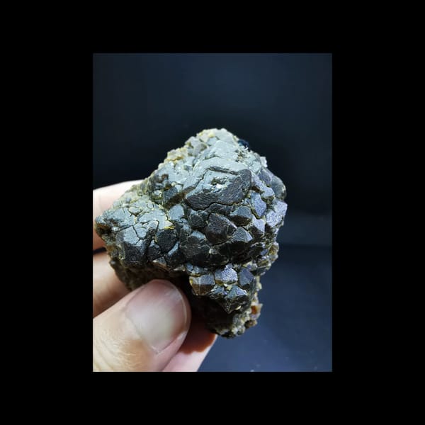 Etched garnet with a specular hematite ball — complete view
