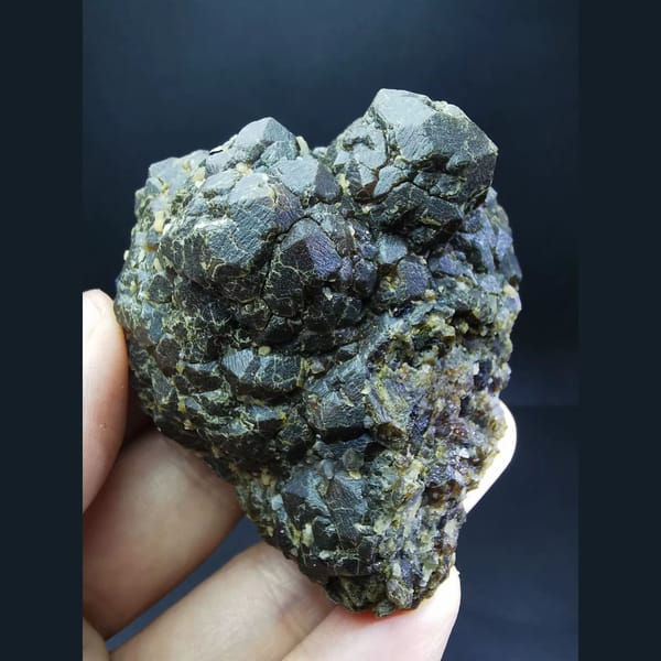 Etched andradite cluster with specular hematite flower — complete view