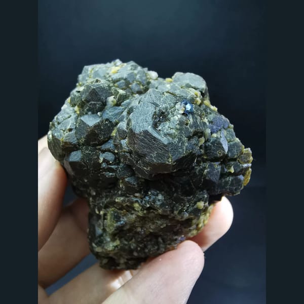 Etched andradite cluster with specular hematite flower — alternate view
