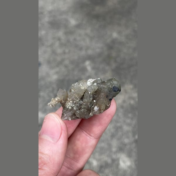 Small smoky grey quartz cluster from Inner Mongolia — detail view