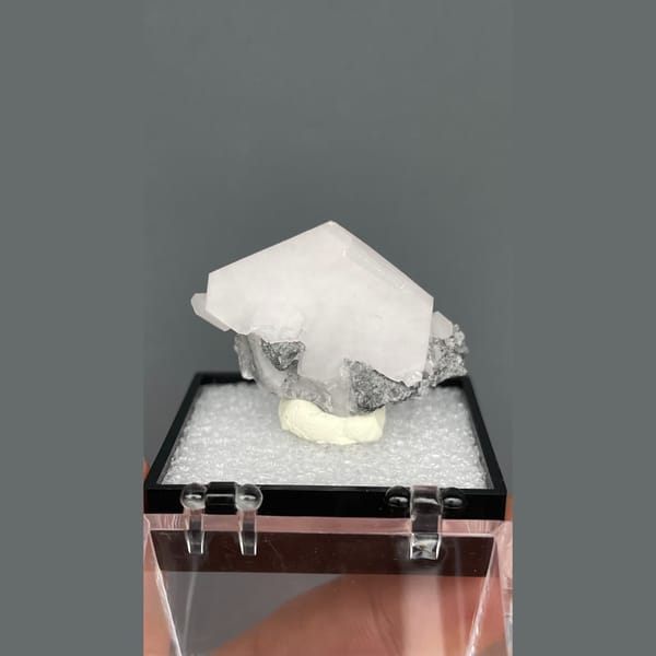 Tabular pale pink calcite in grey matrix from Fujian — alternate view