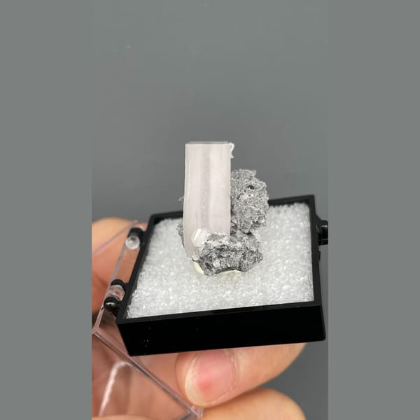 Tabular pale pink calcite in grey matrix from Fujian — alternate view