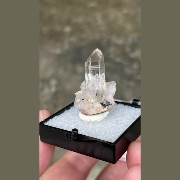 Small clear quartz point on matrix from Guangdong — complete view