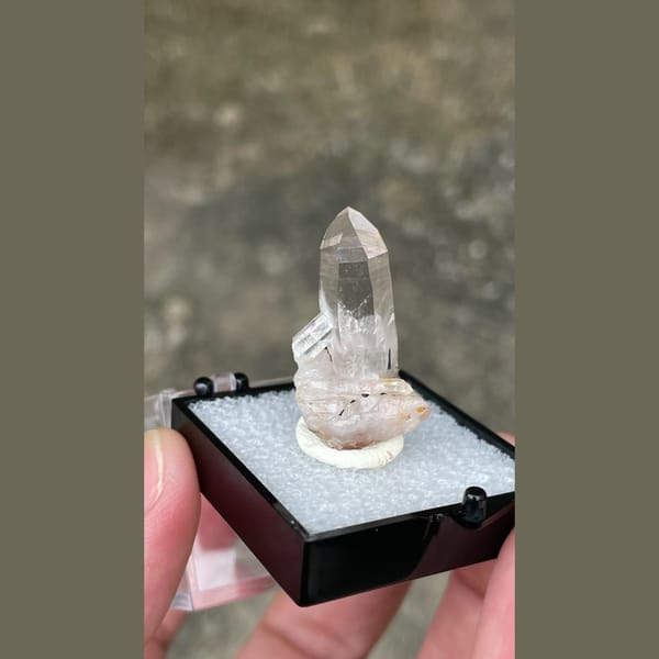 Small clear quartz point on matrix from Guangdong — alternate view